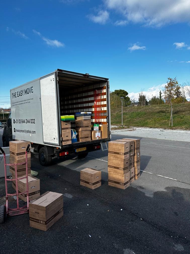 Moving van in Hasselt being loaded with boxes